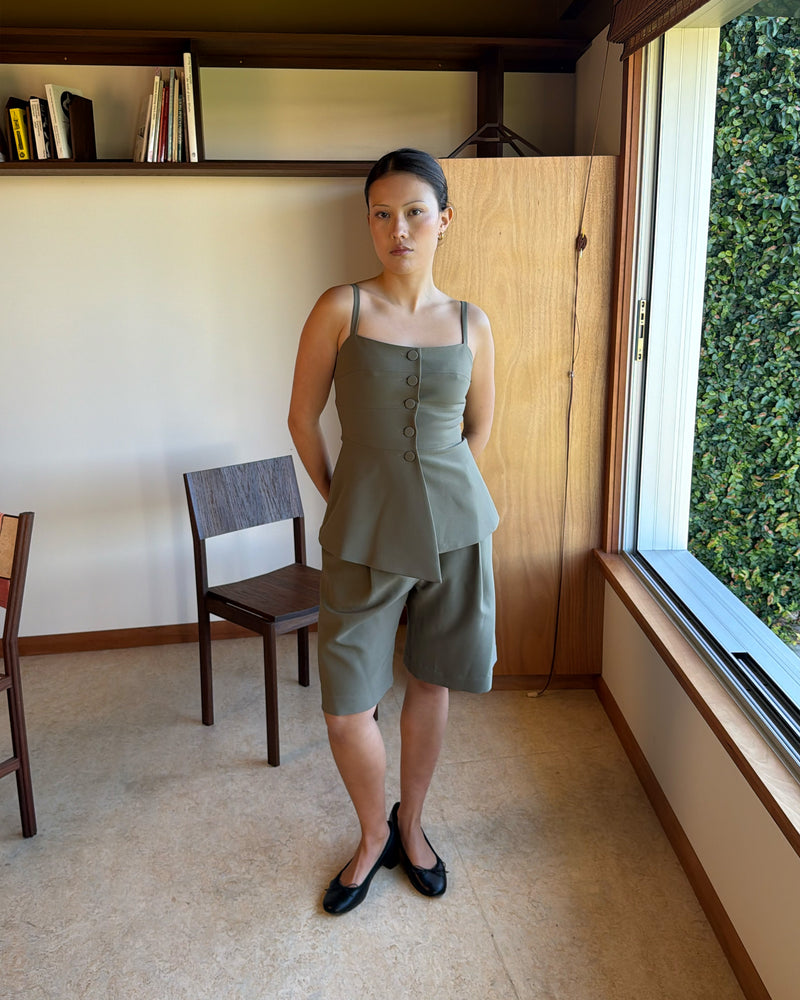COCO BODICE MARTINI OLIVE | Your new workwear staple, this bodice features a soft peplum silhouette and buttoned front, designed in a mid-weight martini olive suiting fabric. Wear as a layer over the Casper Tuxedo Shirt, or pair with the Coco Blazer and Coco Suit...