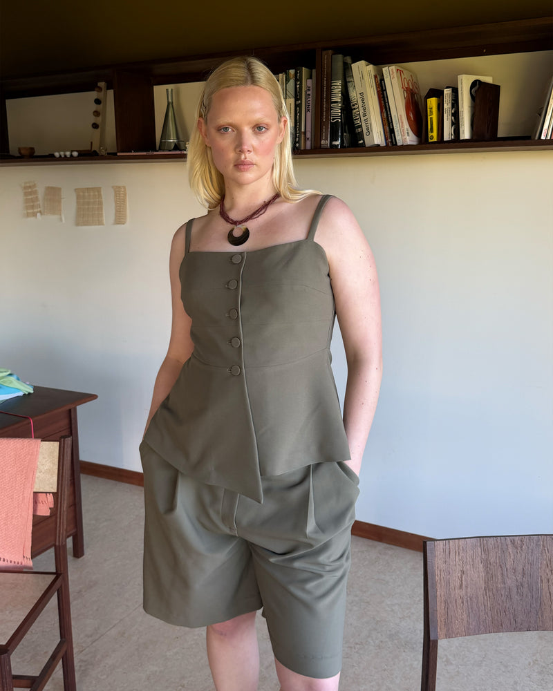 COCO BODICE MARTINI OLIVE | Your new workwear staple, this bodice features a soft peplum silhouette and buttoned front, designed in a mid-weight martini olive suiting fabric. Wear as a layer over the Casper Tuxedo Shirt, or pair with the Coco Blazer and Coco Suit...