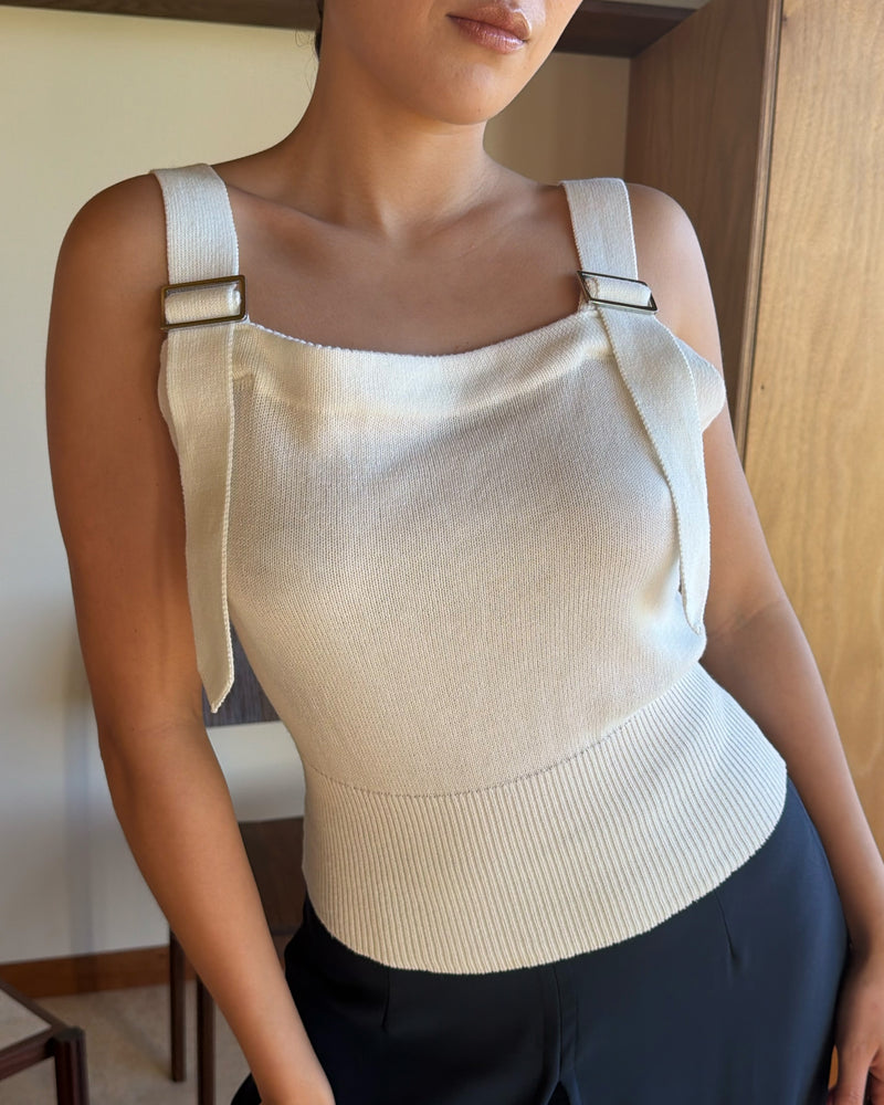 BODE BUCKLE TANK WHITE | White knit tank with buckle features on the straps and a fitted waist, designed in 100% organic cotton. An elevated take on a classic piece, pair with denim for a chic everyday look. 