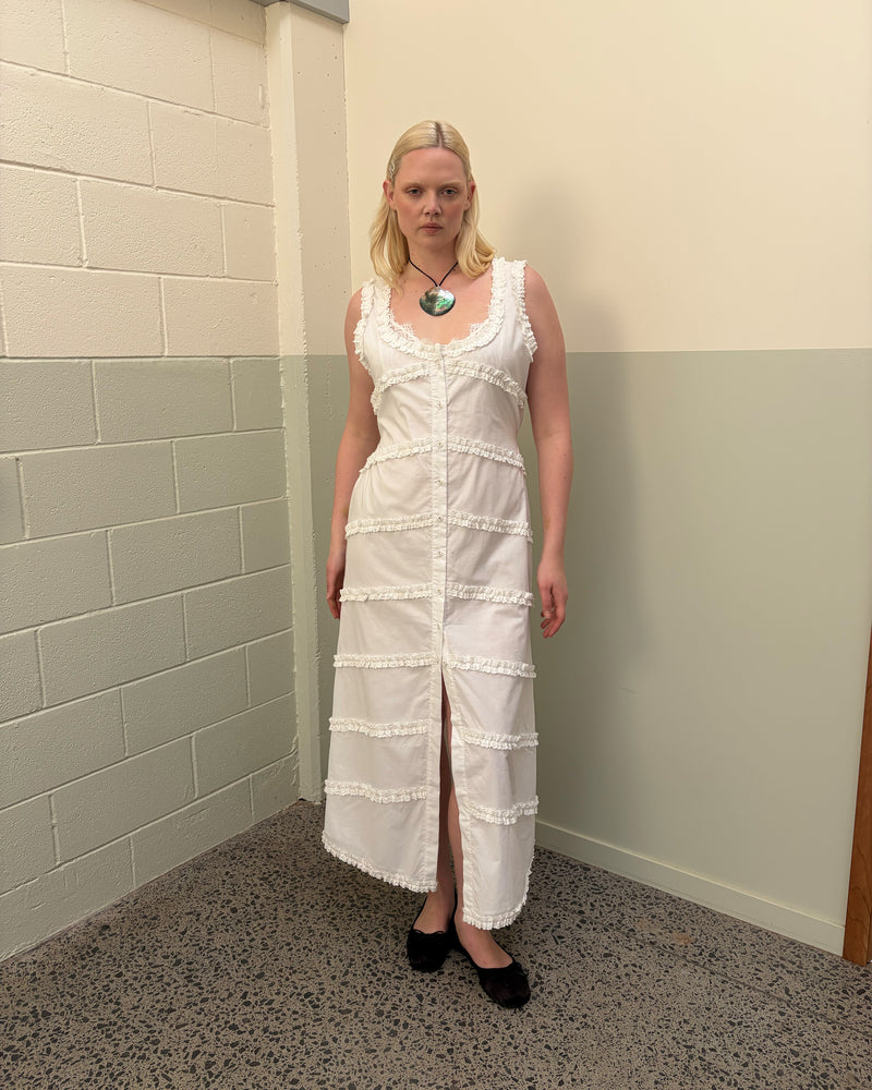 MARTHA MAXI DRESS WHITE | An update to our Martha Mini Dress, this dress is designed in an organic cotton, lined for minimal sheerness, and features ruffle detailing throughout. An essential addition to your wardrobe for any weather, or your new go-to vacation outfit. Style over...