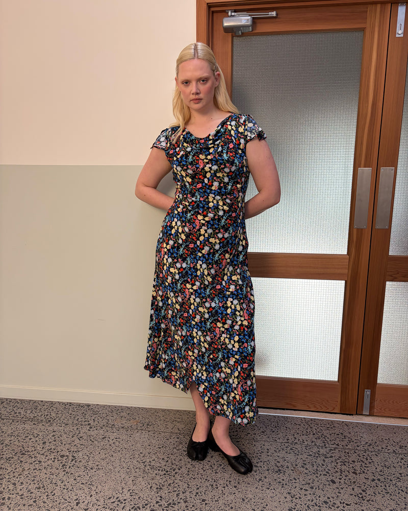 TALIA TIE BACK MAXI DRESS SPRINKLE FLORAL | Bias-cut maxi dress, designed in our light-weight sprinkle floral viscose. Featuring a cowl neckline, split cap sleeves and a lace up back to cinch in the waist, this is the perfect dress for any wedding or special event. 