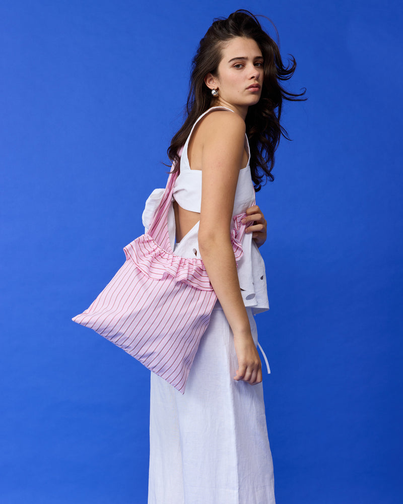 RUBY X EMMA JING MAXI RUFFLE BAG PINK STRIPE | Maxi ruffle bag with an adjustable tie strap, featured as part of Summer Fling with Emma Jing, our Holiday 2024 collaboration with local Aotearoa designer, Emma Jing. A fun take...