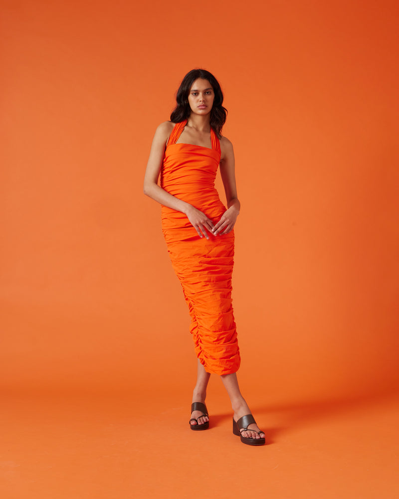 ARIEL HALTER DRESS APEROL | Crafted in a aperol orange coloured cotton, this dress features a halter neck and ruching down the side seams for a pleated look throughout. 