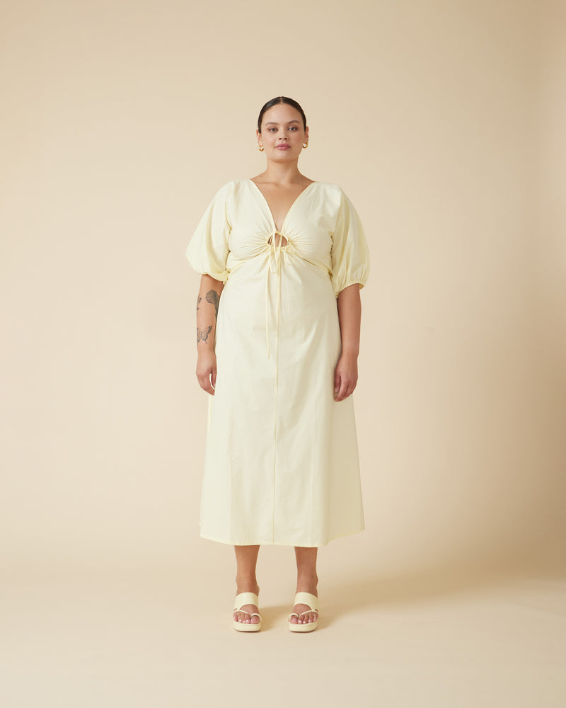 DONOVAN TIE DRESS BUTTER | Cotton A-line midi dress with short batwing sleeves and keyhole opening with a tie detail at the centre neckline. The tie can be used to cinch in your waist, the piece then falls...