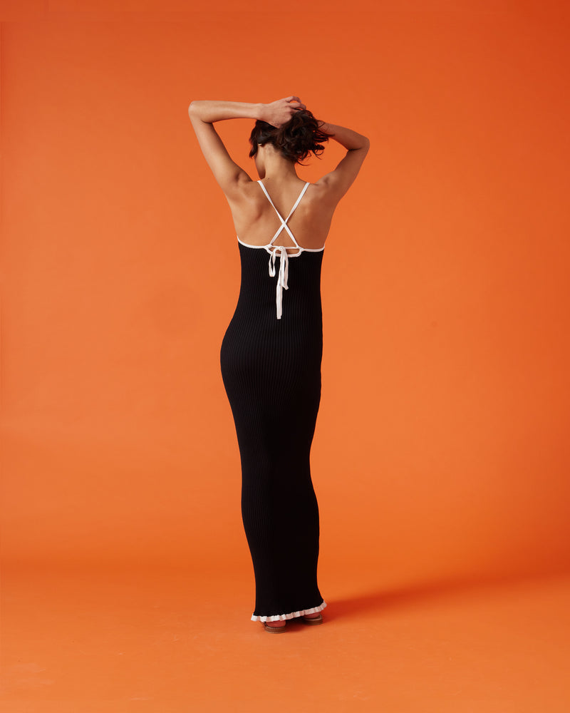 RINA DRESS BLACK WHITE | Ribbed knitted maxi dress designed in a two-tone black and white colour way. This staple dress can be worn many ways by adjusting the straps, giving you 4 options in 1.