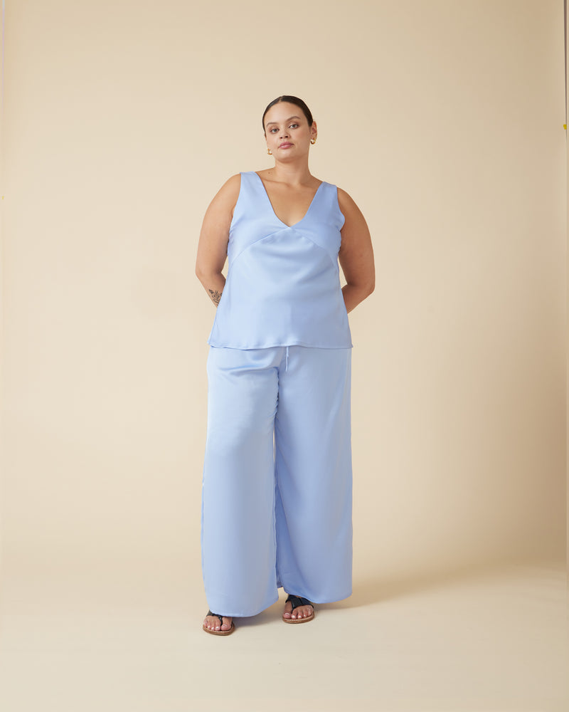 ANDIE SATIN PANT SERENITY | Palazzo style pants with an elastic waist band & tie, in a luxurious serenity blue satin. These pants are high waisted, uncomplicated and classically cool.