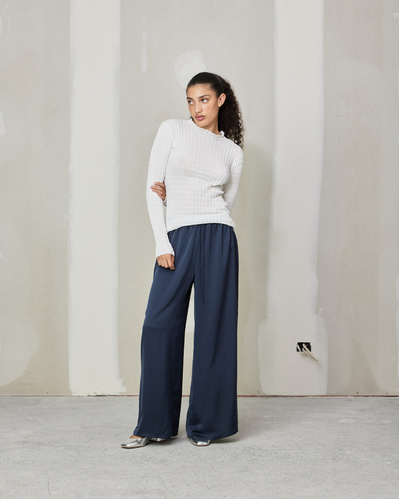  ANDIE SATIN PANT INK | Palazzo style pants with an elastic waist band & tie, in a luxurious ink satin. These pants are high waisted, uncomplicated and classically cool.