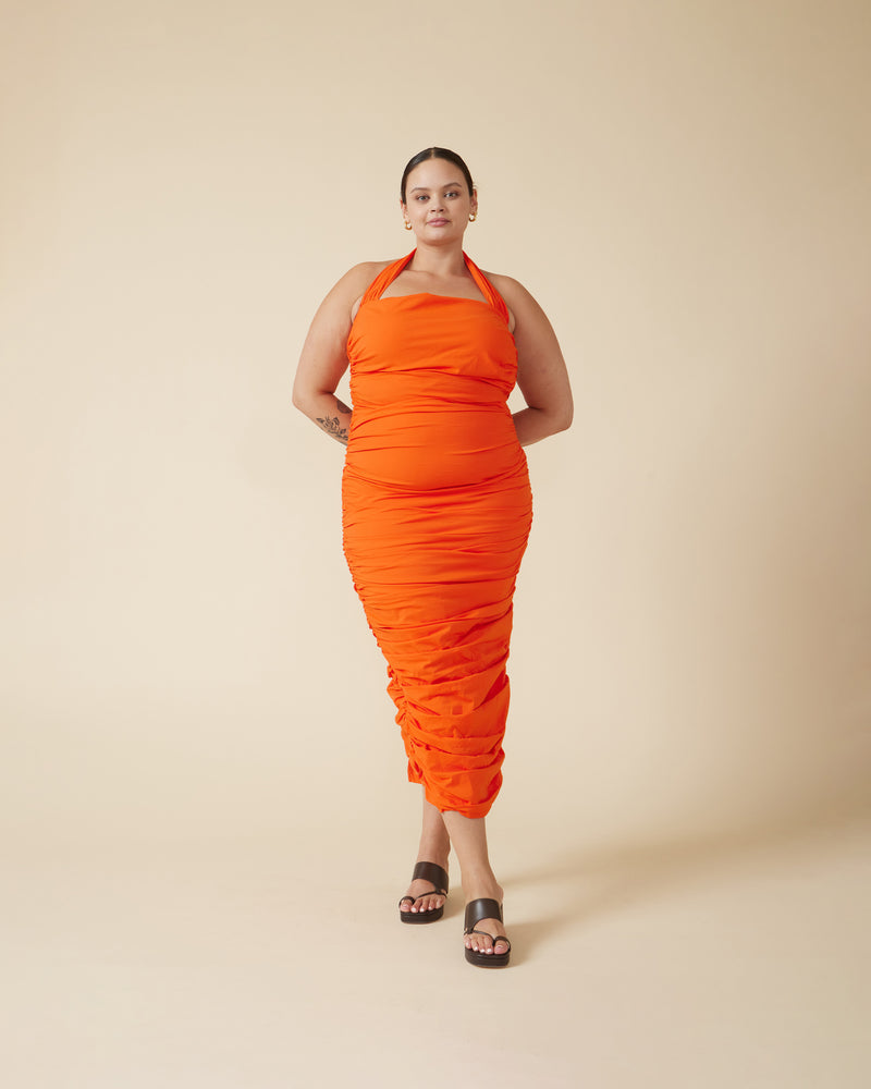 ARIEL HALTER DRESS APEROL | Crafted in a aperol orange coloured cotton, this dress features a halter neck and ruching down the side seams for a pleated look throughout. 