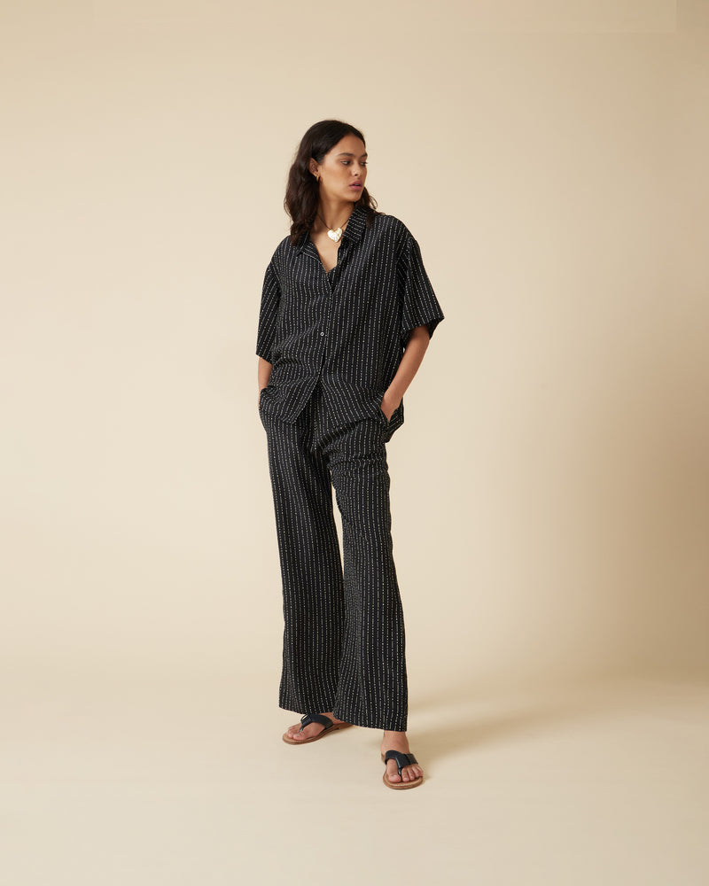 CAMERON SILK SHIRT BLACK BAMBOO | Boxy short sleeve shirt designed in a bamboo print silk. Simple in shape yet versatile, this shirt can we worn as a set with the matching Cameron Silk Pant or as a...