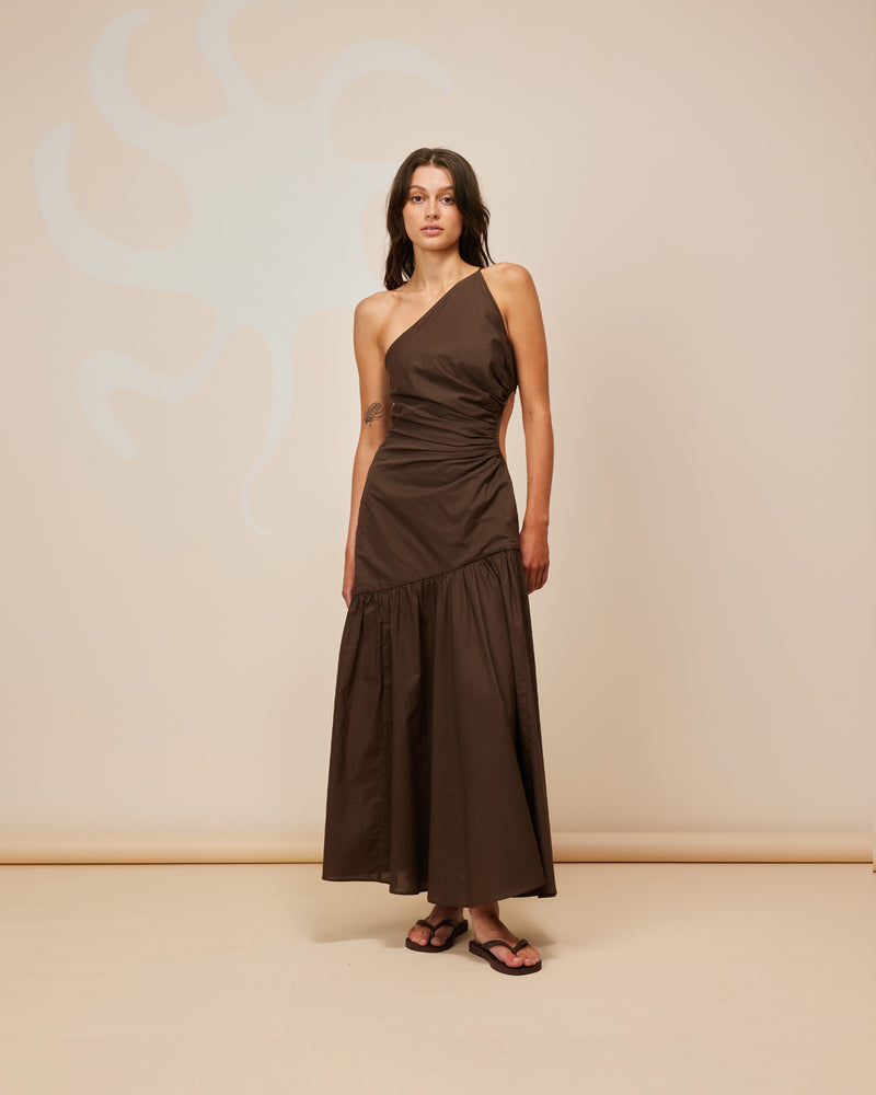 BETTINA CUT OUT DRESS CHOCOLATE | Asymmetrical one shoulder midi dress with a circular cut-out at the waist in a light weight chocolate cotton. This dress is designed to be a stand-out.