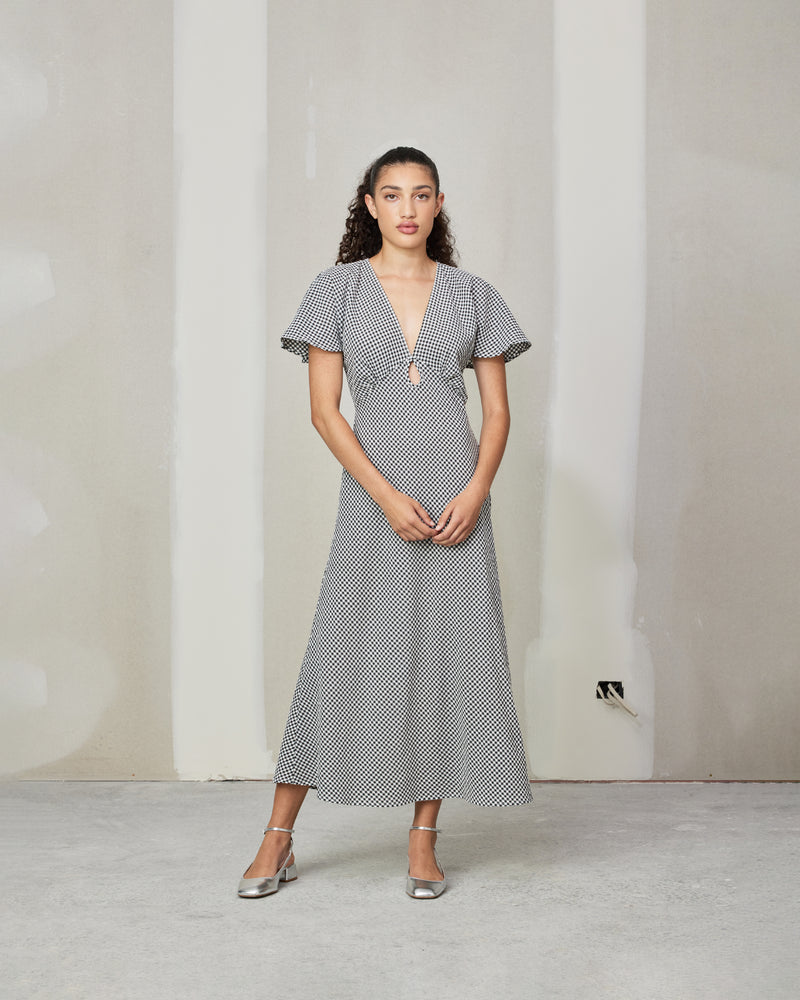 CLOVER MIDI DRESS BLACK GINGHAM | V-neck midi dress with front keyhole detail, made in a lightweight cotton gingham. Fitted around the waist flowing to an A-line skirt, this dress is a timeless piece.