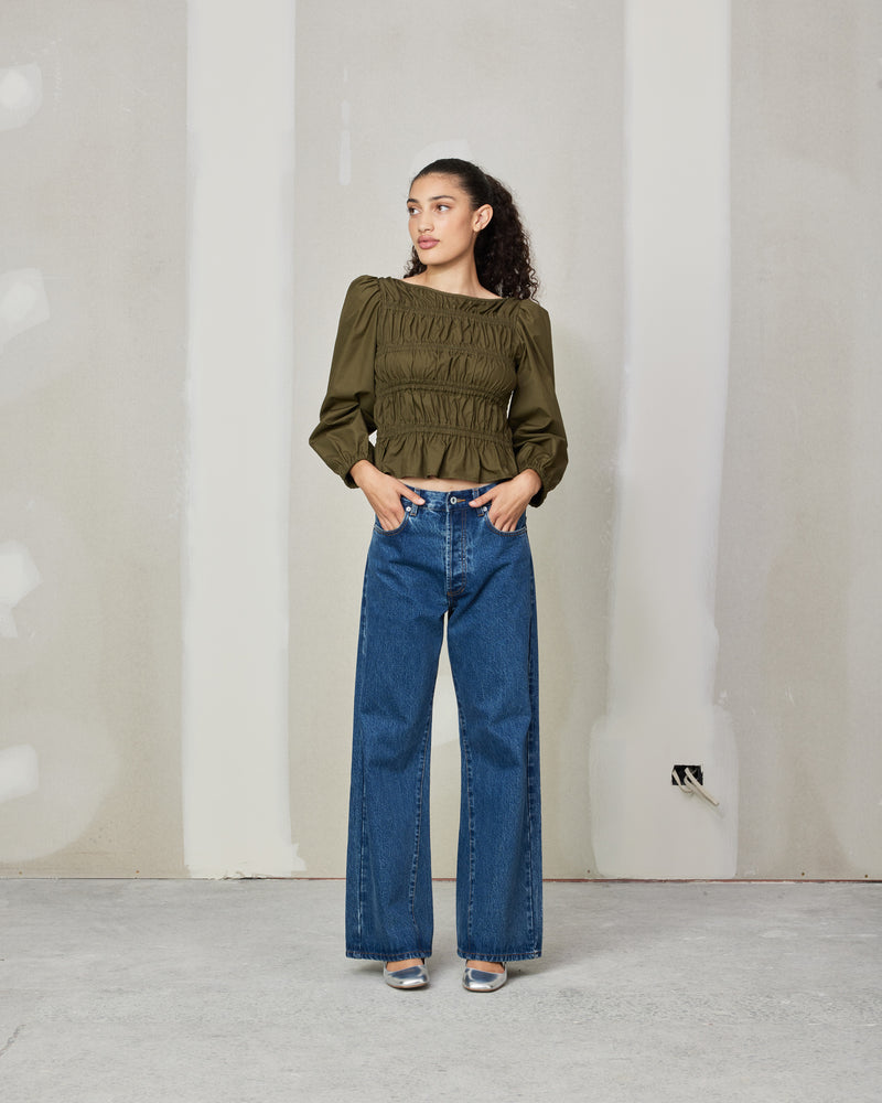 COMET BLOUSE KHAKI | 
Long sleeve cotton blouse with shirring throughout the body to create texture. Features elastic at the cuff to create a sublte puff sleeve.