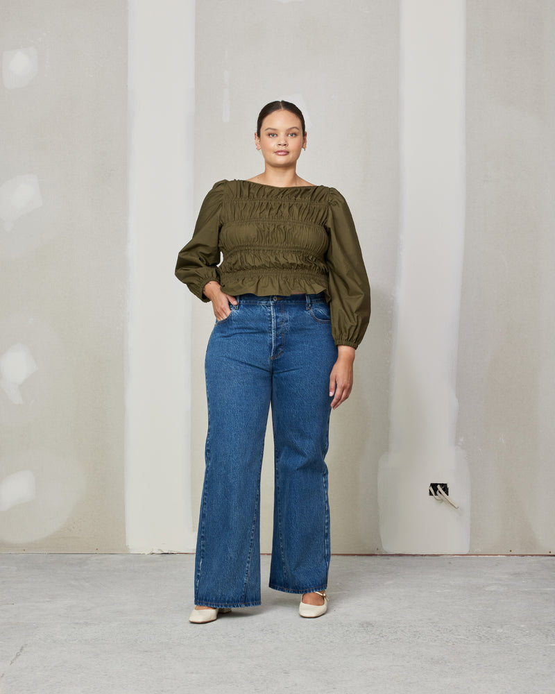 COMET BLOUSE KHAKI | 
Long sleeve cotton blouse with shirring throughout the body to create texture. Features elastic at the cuff to create a sublte puff sleeve.
