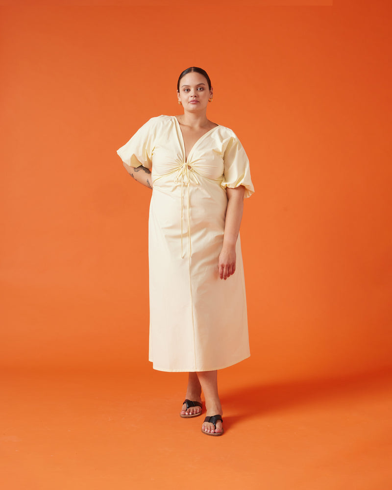 DONOVAN TIE DRESS BUTTER | Cotton A-line midi dress with short batwing sleeves and keyhole opening with a tie detail at the centre neckline. The tie can be used to cinch in your waist, the piece then falls...