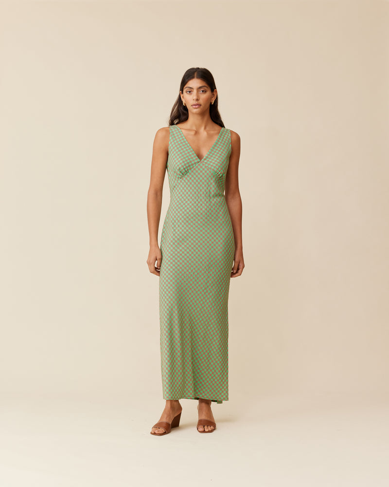 ESME GINGHAM SLIP DRESS GREEN AND BROWN GINGHAM | Bias cut midi dress in a green and brown gingham. Wide straps and a panelled V-neck front and back give this dress a vintage shape. Features a waist tie and...