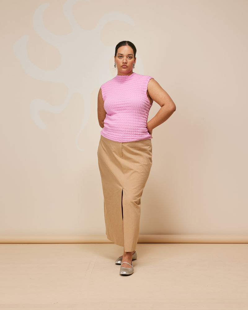 RAFFIA SKIRT CAMEL | Straight fit midi skirt cut from a mid-weight tan cotton drill. A timeless staple that features a front split for movement and pockets to house your essentials.