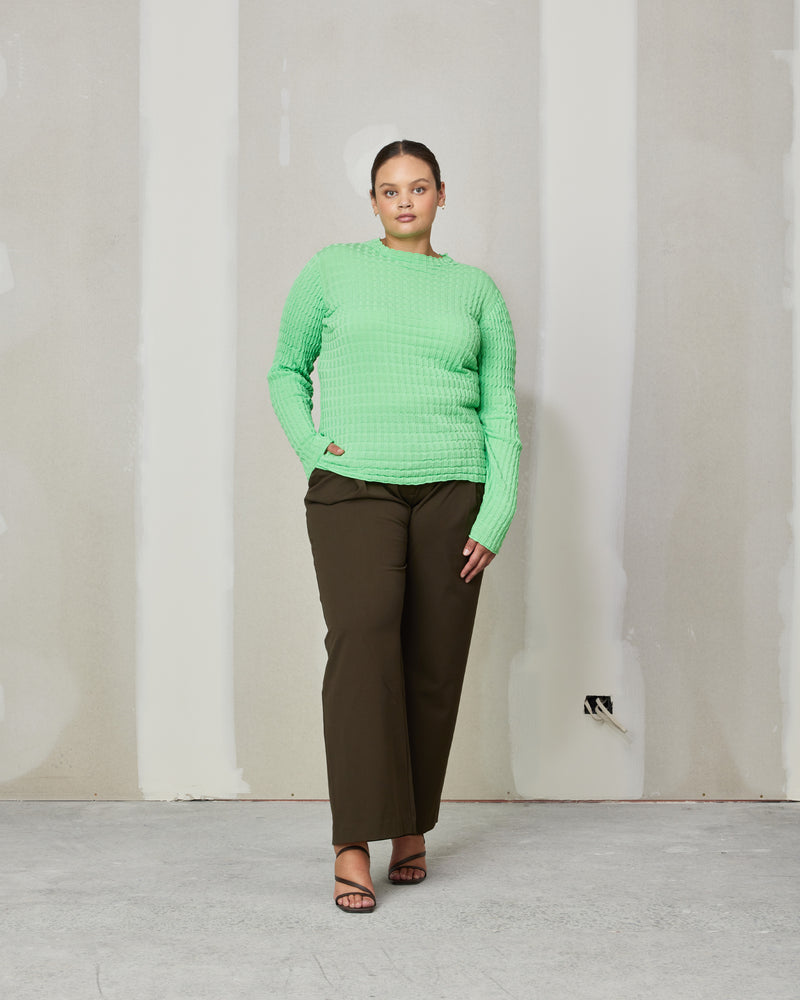 HONEYCOMB LONGSLEEVE LIME | 
Long sleeve top knitted with a textured ribbed stitch that creates a honeycomb look throughout the fabric. Features a mock neck and sits just on the hip.