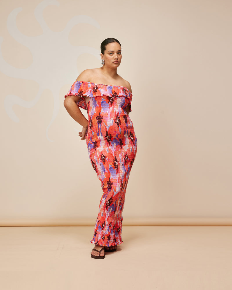 JAQUETTA DRESS POPPY FLORAL | Off-shoulder shirred cotton maxi dress designed in a vibrant poppy floral print. This dress is a win-win situation, look seriously good whilst being seriously comfy in the shirred, stretch cotton.