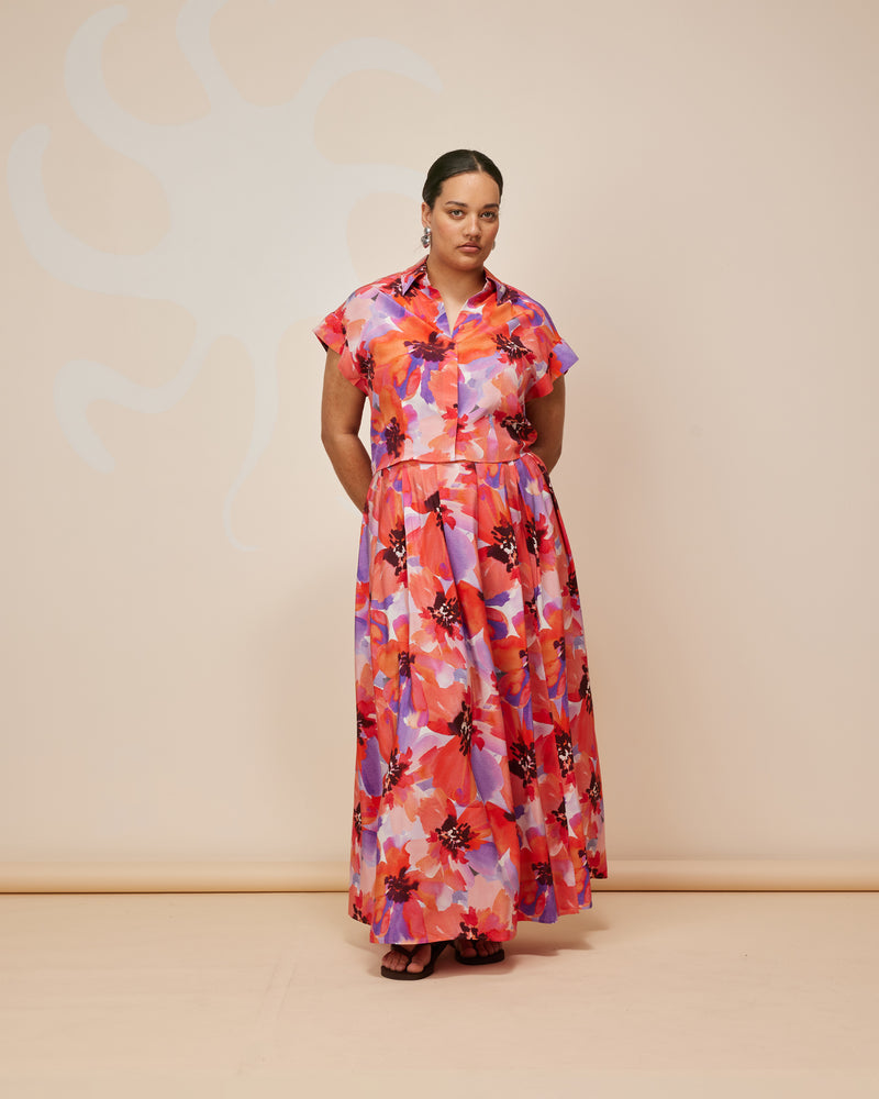 JAQUETTA SILK SKIRT POPPY FLORAL | Pleated maxi skirt designed in a striking poppy floral print. Featuring a flat waistband and side split to bring extra movement to this piece.