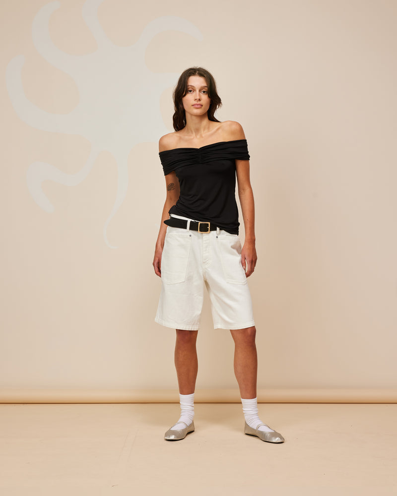  MERCI DENIM SHORT WHITE | Long-line denim short designed in a crisp white denim. These shorts have large feature pockets which add to the baggy, cargo style.