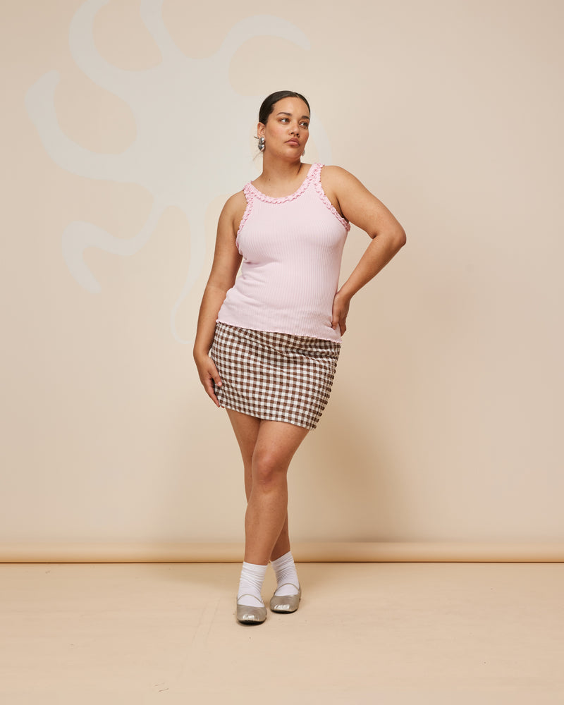 PRISM MINISKIRT BROWN GINGHAM | Gingham miniskirt designed in a seersucker textured cotton. Featuring a decorative tie at the waist, this skirt is an elevated staple to style with with tanks, shirts and tees alike.
