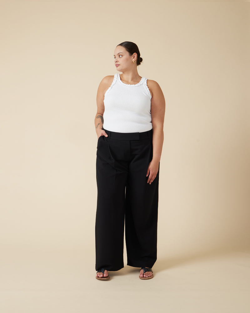 RUE TROUSER BLACK | Straight leg mid-waist suit trouser with a flat waistband and belt loops. These pants are versatile in that they can we be worn casual with a baby tee, or formal with...