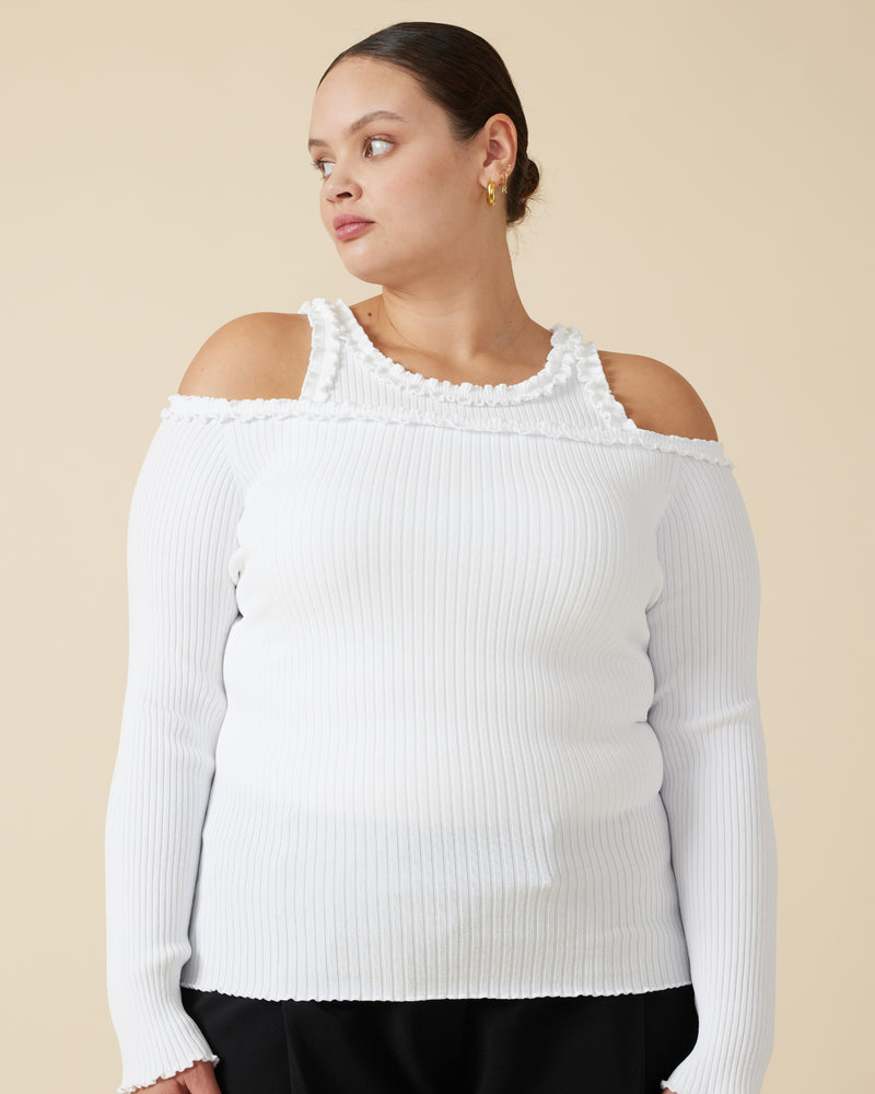 LOLLO LONG SLEEVE WHITE | This off-the-shoulder long sleeve top features a delicate ruffle along the neckline, complementing its ribbed texture throughout. Pairs perfectly with the Lollo Tank.