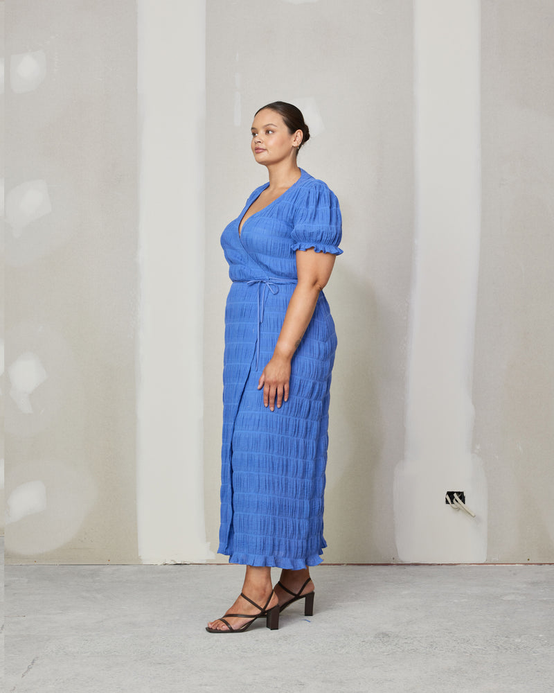 MIRELLA SHORT SLEEVE WRAP DRESS PERIWINKLE | Floaty wrap dress with short elasticated ruffle sleeves and an adjustable waist tie in the signature Mirella fabric, a delicate embroidered cotton. Like all wrap dresses, this piece is incredibly...
