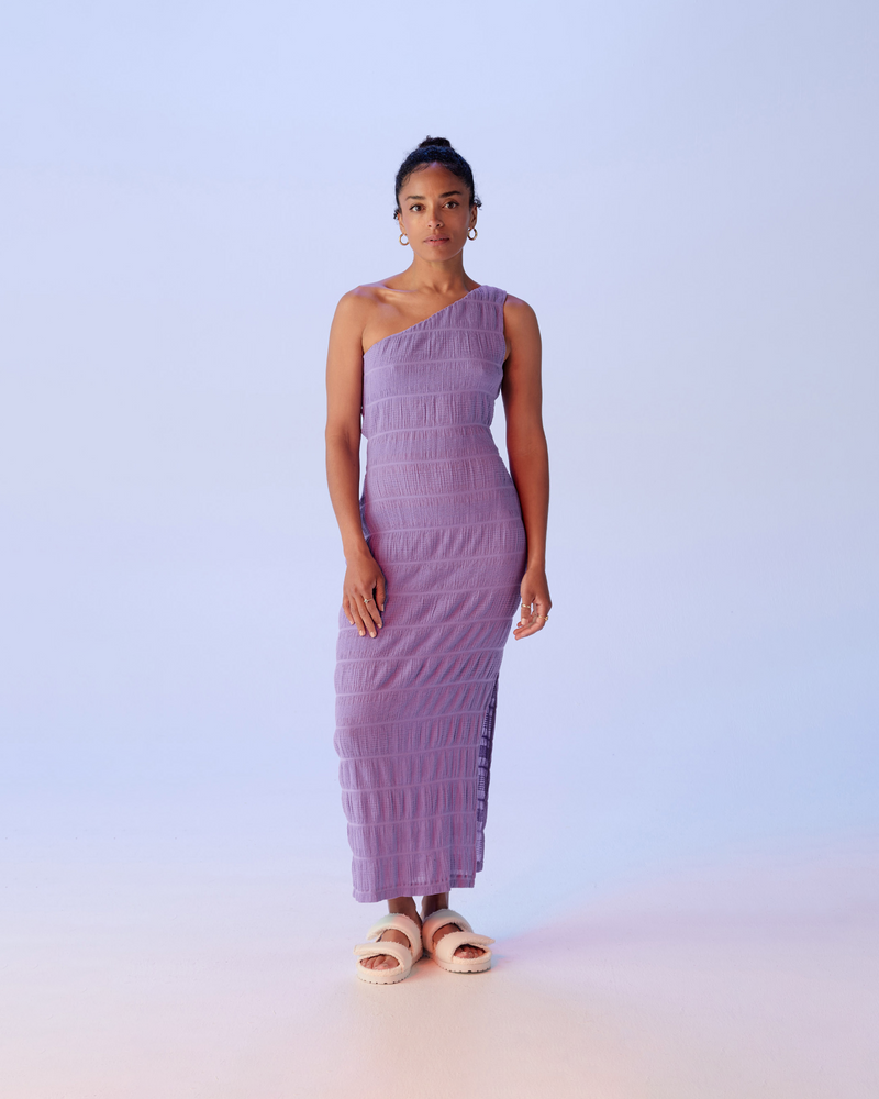 MIRELLA ASYMMETRICAL DRESS GRAPE | Asymmetric one shouldered maxi dress, this piece is fitted throughout the body with a side split at the leg. Crafted in signature RUBY Mirella fabric, a delicate embroidered cotton with...