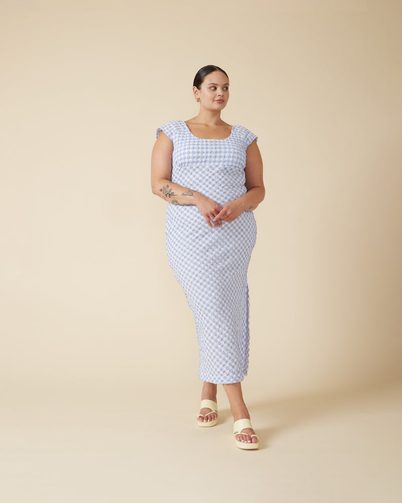 PRISM MIDI DRESS PERIWINKLE GINGHAM | Cap sleeve gingham midi dress with bust detailing and a scoop back. It’s all in the details with this piece, with the gingham featuring a gathered seersucker texture and the...