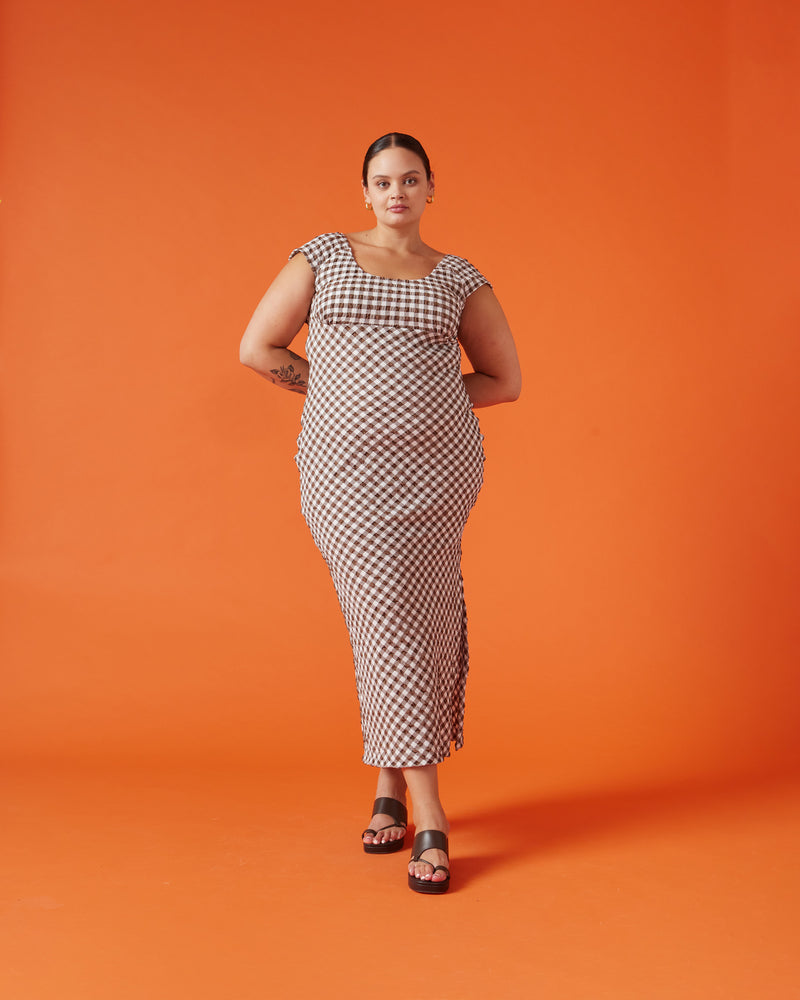 PRISM MIDI DRESS BROWN GINGHAM | Cap sleeve gingham midi dress with bust detailing and a scoop back. It’s all in the details with this piece, with the gingham featuring a gathered seersucker texture and the...
