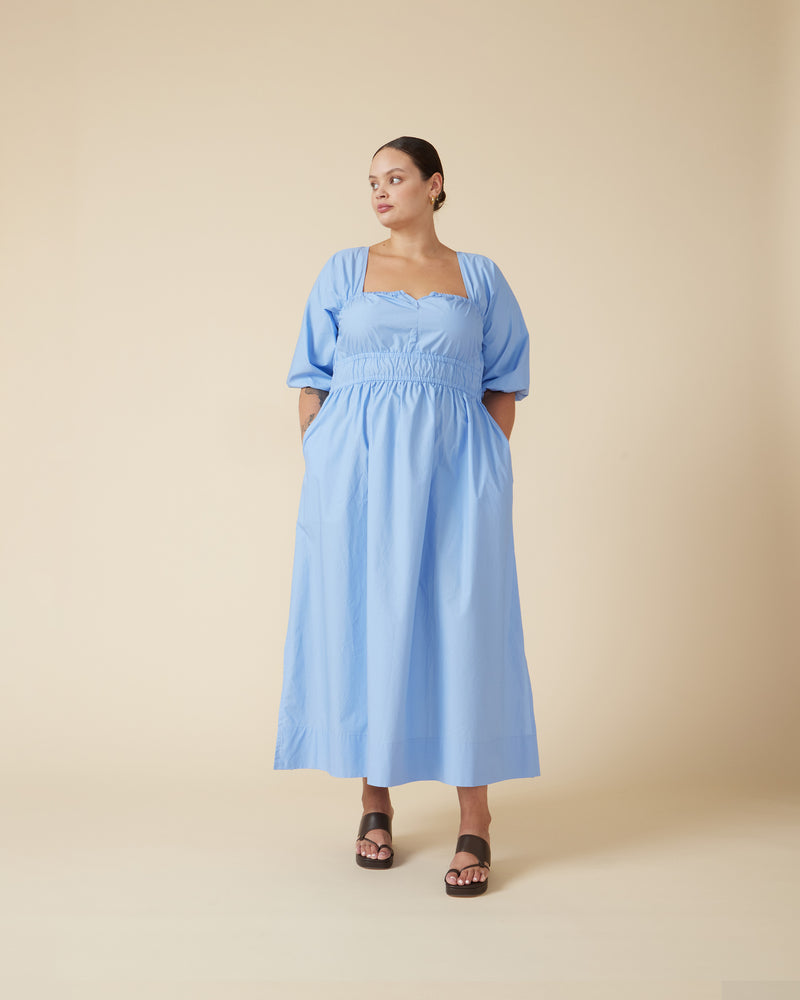 REMI DRESS CORNFLOWER | 
Puff sleeve cotton midi dress with an elasticated bust line and waist. This dress has a side split which adds some floatiness to the full skirt. 