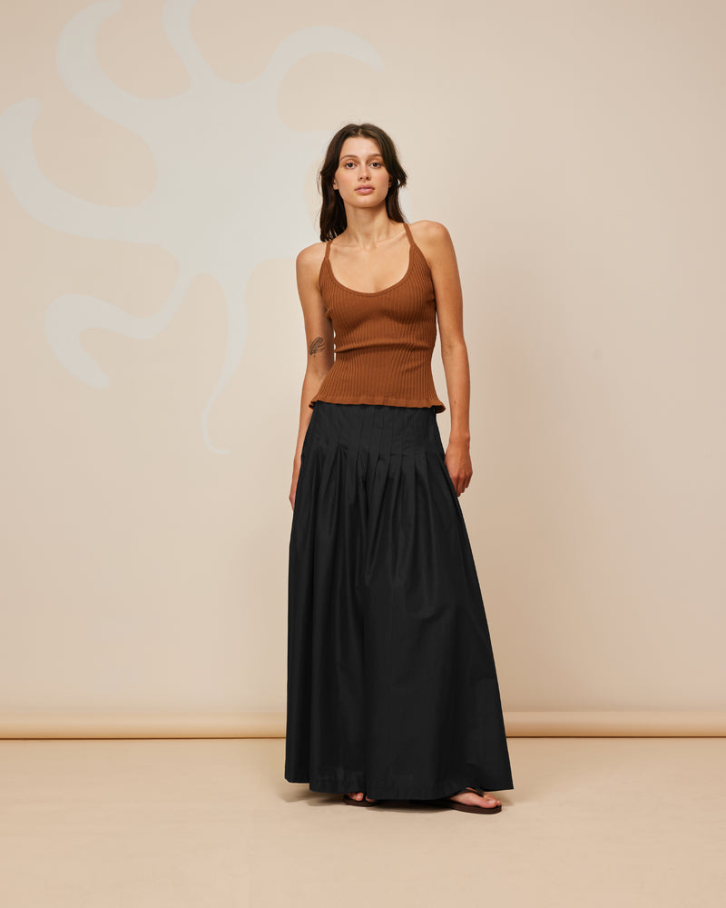 SANDLER SKIRT BLACK | Tennis style maxi skirt with a pleated drop waist. Designed in a soft, black cotton, this skirt is floaty when you walk and is cool to wear.