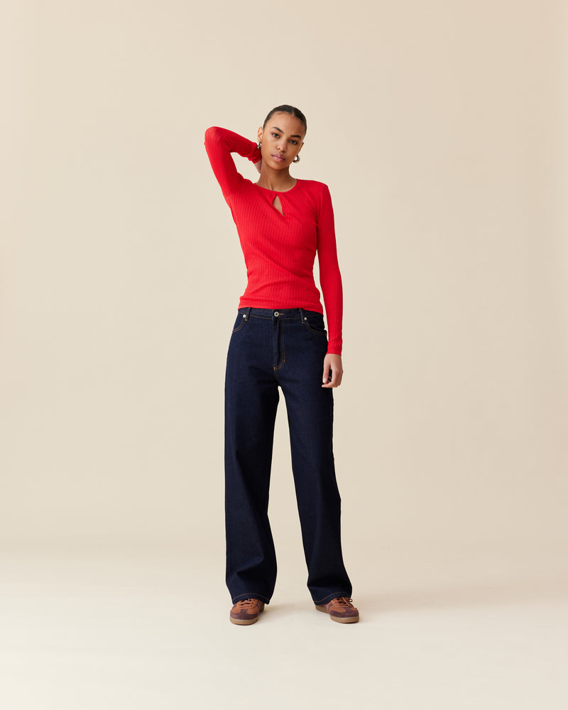 WREN KNIT LONGSLEEVE CHERRY | A RUBY take on a staple knit top. Designed in a cherry red ribbed knit, this long sleeve is fitted to the form with a keyhole detail that takes this...