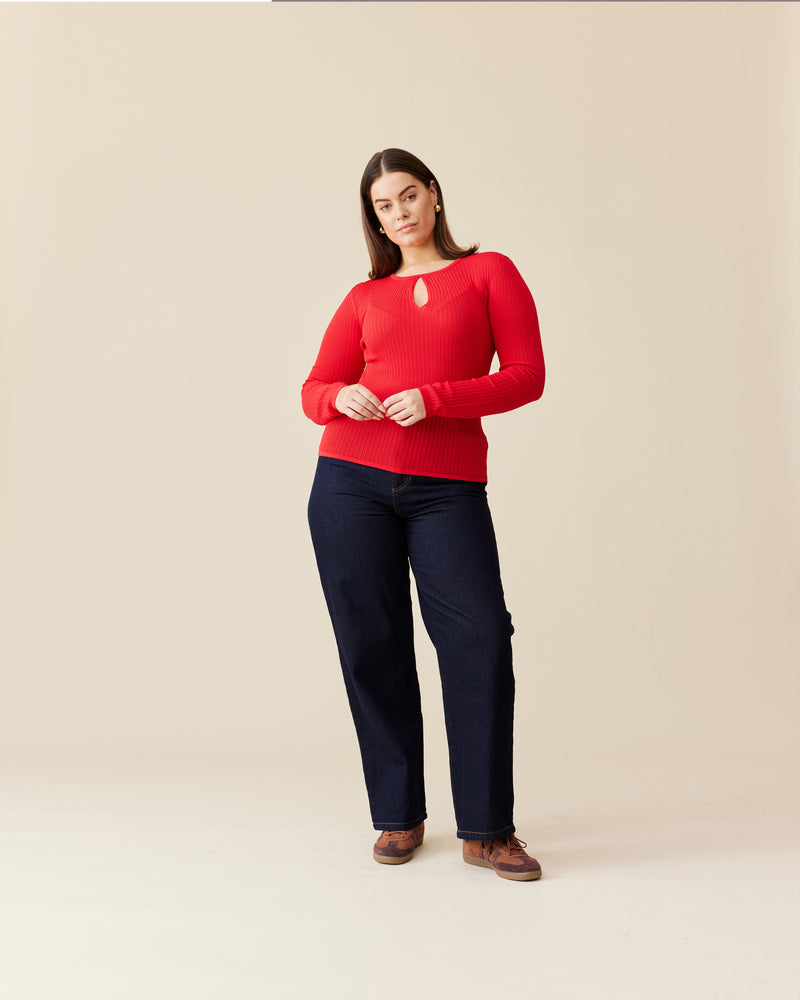 WREN KNIT LONGSLEEVE CHERRY | A RUBY take on a staple knit top. Designed in a cherry red ribbed knit, this long sleeve is fitted to the form with a keyhole detail that takes this...