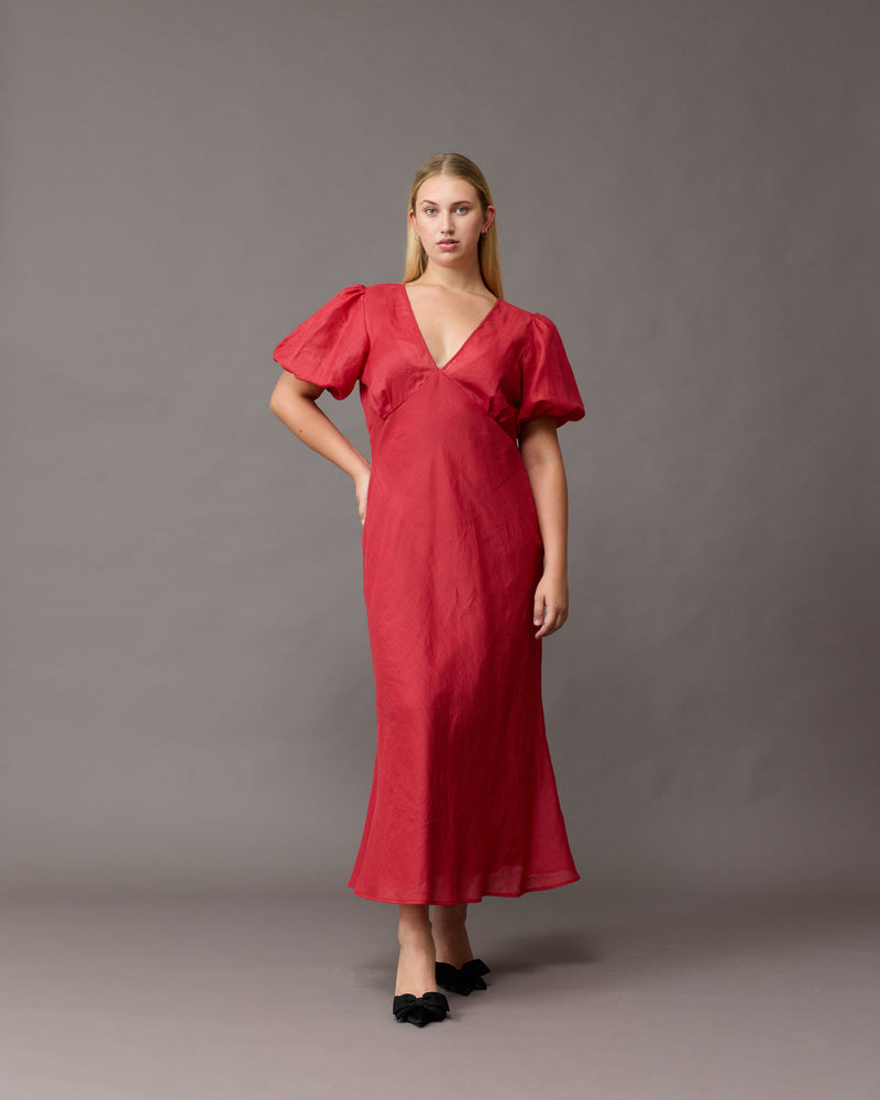 UMA RAMIE DRESS  SANGRIA | Bias cut ramie maxi dress with tie closure and a V-neck front and back. Cut in rich sangria colour, with elasticated puff sleeves and ruched detailing under the bust, this new twist...