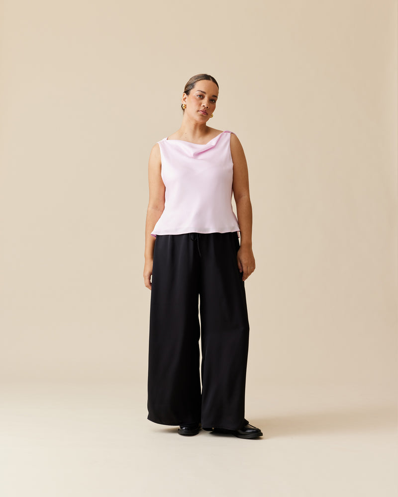 ANDIE SATIN PANT BLACK | Palazzo style pants with an elastic waist band & tie, in a luxurious black satin. These pants are high waisted, uncomplicated and classically cool.