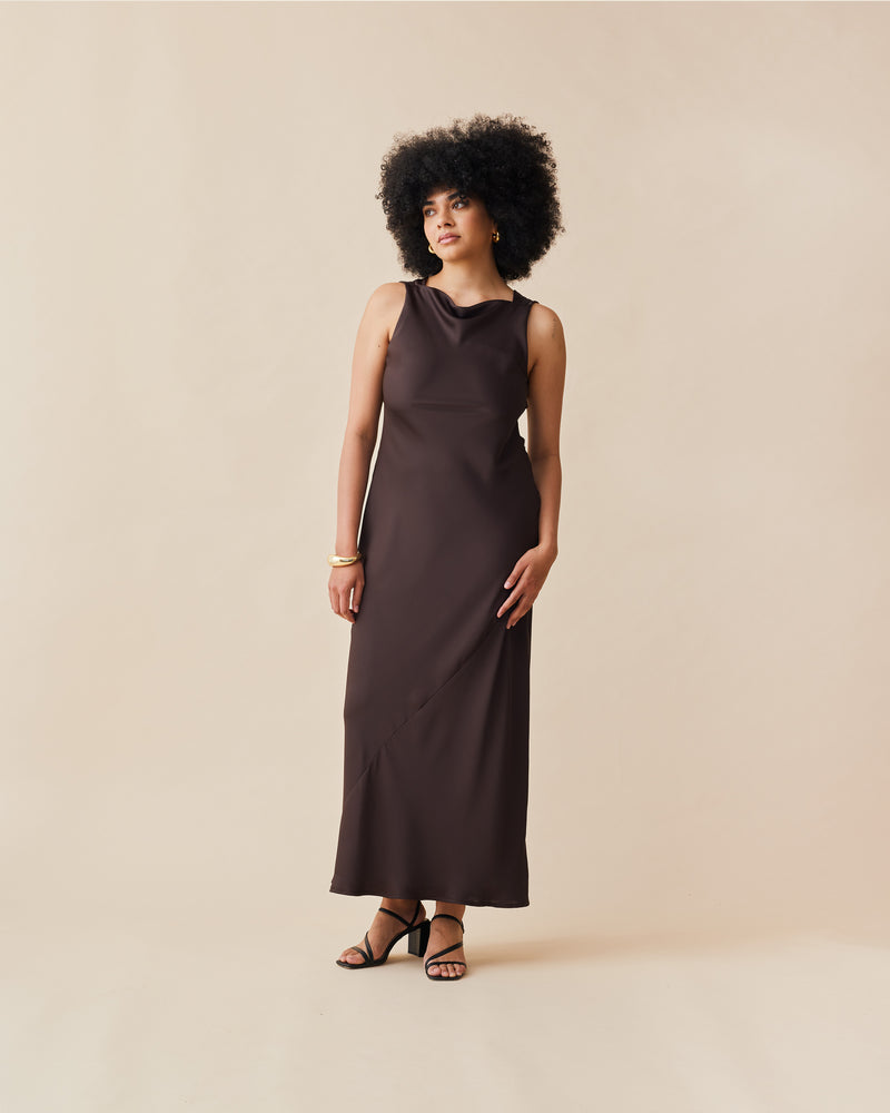 FIREBIRD COWL GOWN ESPRESSO | Sleeveless midi dress crafted in rich espresso satin. Features a minimal silhouette with a cowl back detail and a tie to cinch in the waist.