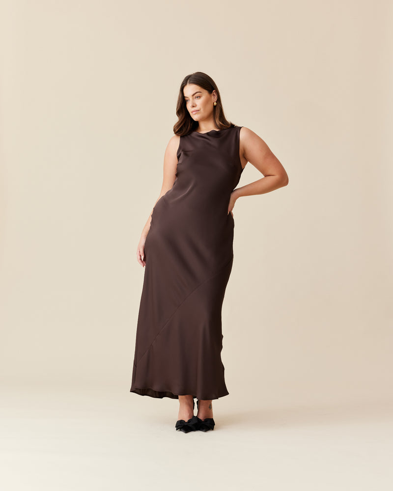 FIREBIRD COWL GOWN ESPRESSO | Sleeveless midi dress crafted in rich espresso satin. Features a minimal silhouette with a cowl back detail and a tie to cinch in the waist.