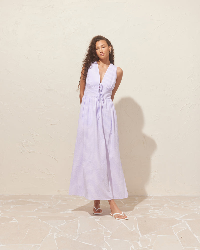 BENNY TIE DRESS LILAC STRIPE | This dress features a panel detail at the waist two ties and falls into an A-line skirt, giving a floaty, beachy look.