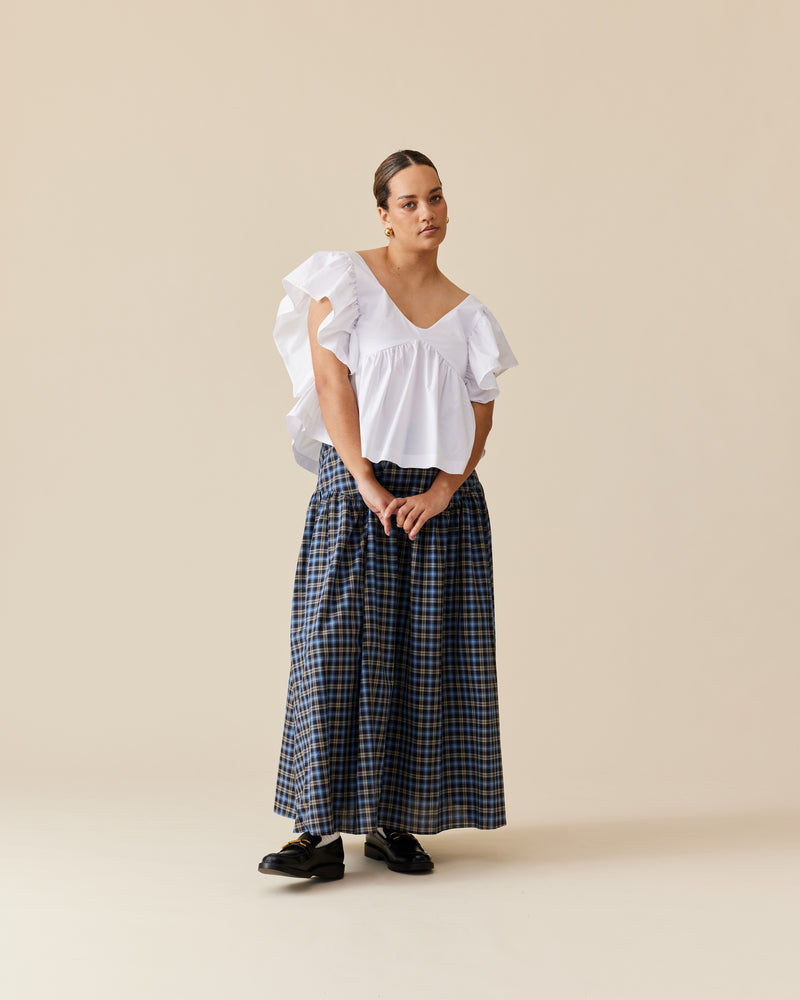 TRULLI SKIRT BLACK TARTAN | Floaty basque style maxi skirt imagined in a black tartan cotton. This skirt features a dropped bodice style waistline, that falls to a full, wide skirt.