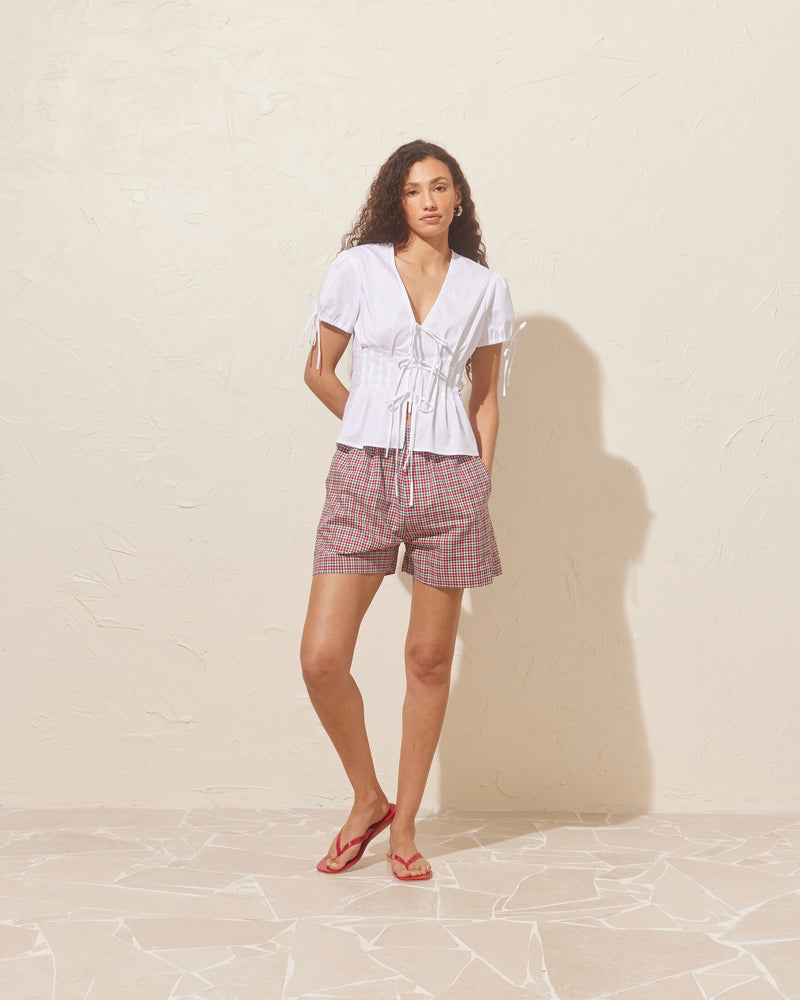 IDA SHORT BLUE RASPBERRY TARTAN | Boxer-style short designed in a raspberry tartan cotton. These shorts are relaxed and easy to wear and perfectly pair with our Trulli Tie Top.