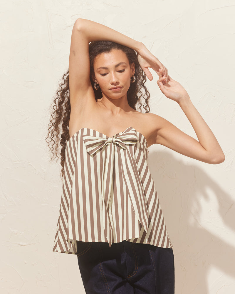 CARMEN BODICE BROWN BUTTER STRIPE | Bodice-style top that appears floaty and relaxed, but is supportive against the body with hidden boning detailing underneath. This top has a feature bow at the centre, that can be...