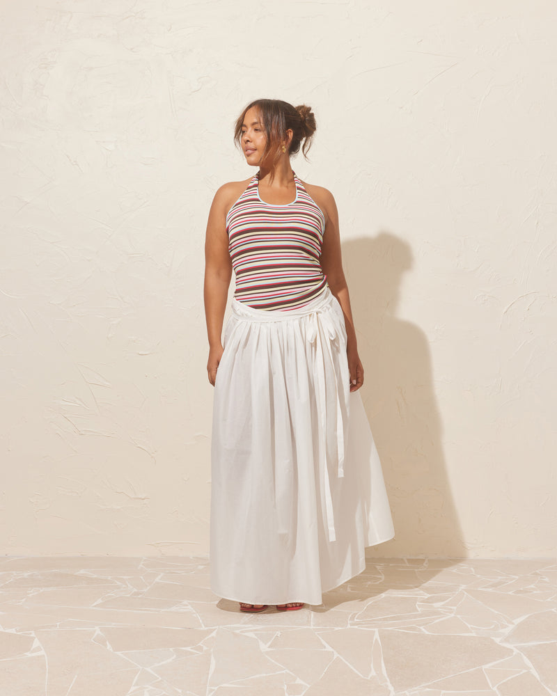 BALLERINA MAXI SKIRT WHITE | Ballerina-inspired skirt designed in a crisp cotton. This skirt has 2 waist ties, with pleat detailing at that waist that completes the Ballerina vibe.