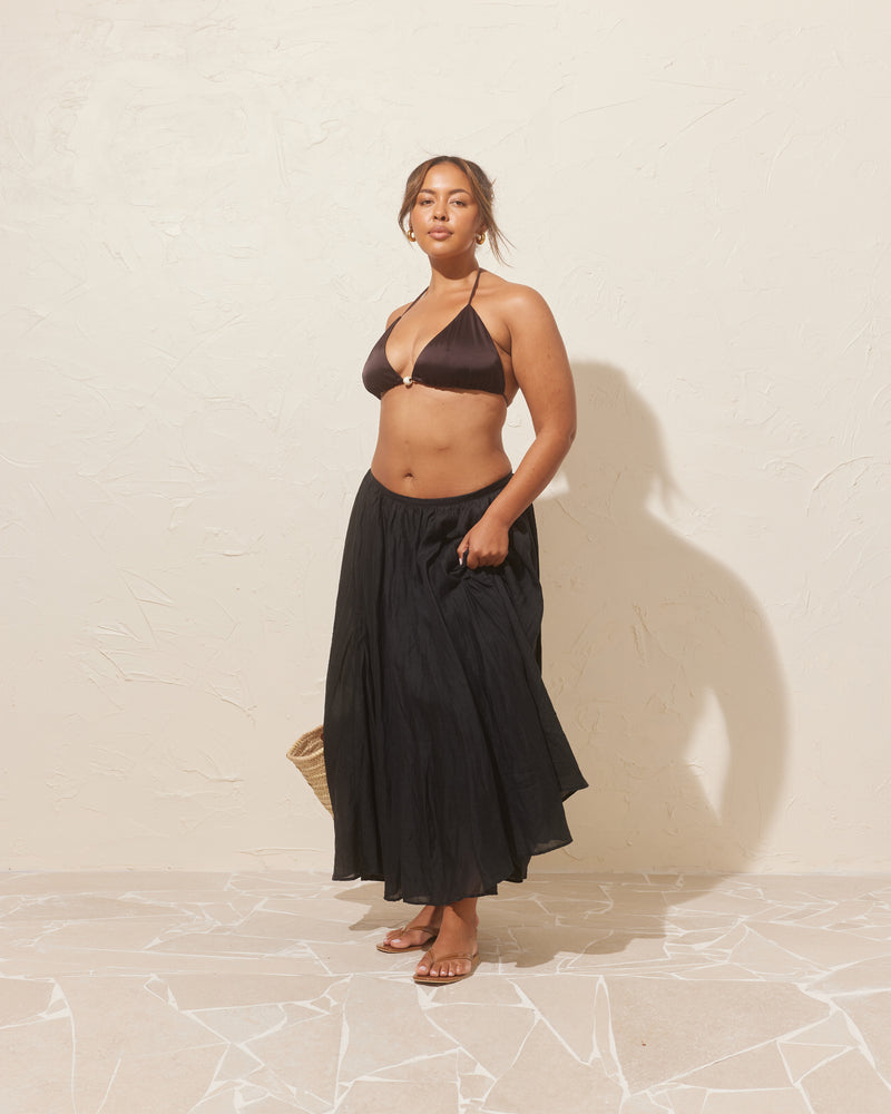 HYDRA SKIRT BLACK | Gathered maxi skirt designed in a textured raime voile. This skirt sits light and floaty, with a flat waistband. Truly the perfect summer staple. 