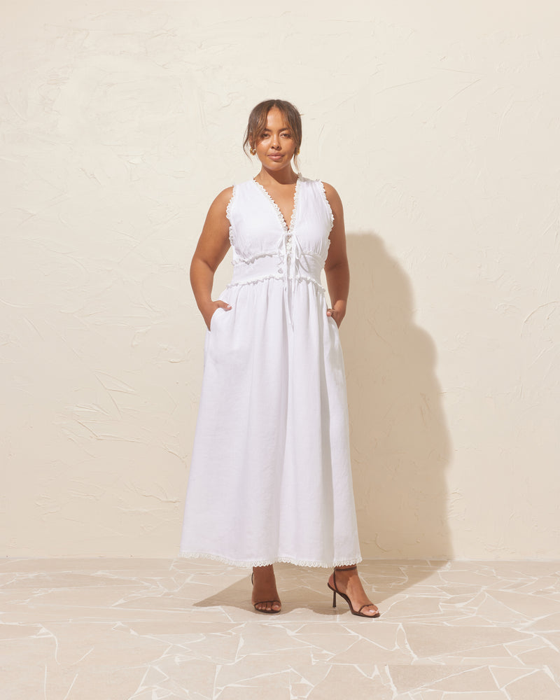 BENNY TIE DRESS WHITE | An update on a Rubette favourite, this maxi dress is imagined in a soft linen with lace trim detailing. Features a panel detail at the waist with two ties and...