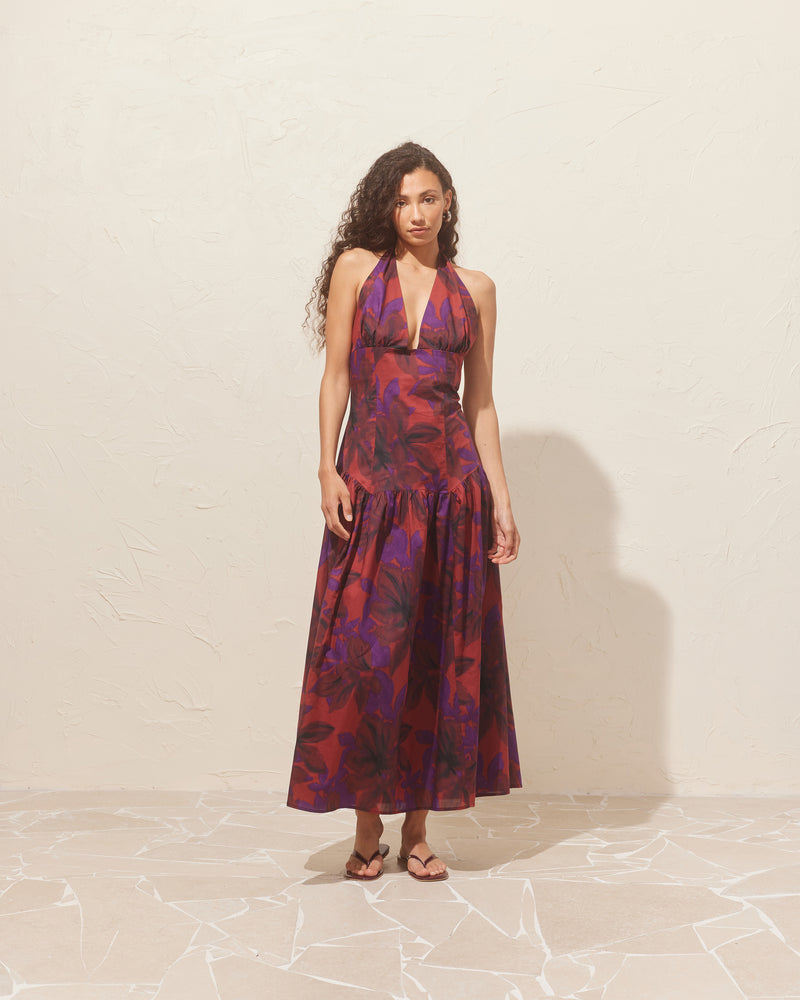 RELAXE HALTER DRESS SAMBA | Halter maxi dress designed in a samba floral organic cotton. This dress is fitted through the body, and then falls to a floaty basque-style skirt. Features a bodice-style waistline with...