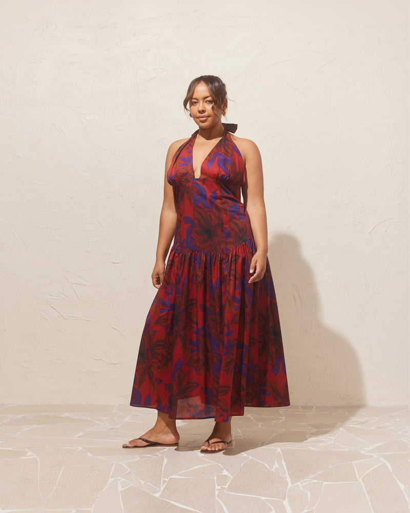 RELAXE HALTER DRESS SAMBA | Halter maxi dress designed in a samba floral organic cotton. This dress is fitted through the body, and then falls to a floaty basque-style skirt. Features a bodice-style waistline with...