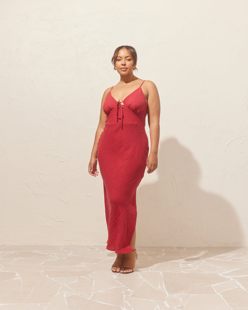 HARLEY BOW DRESS SANGRIA | Shoestring cotton midi dress designed in a sangria coloured linen. Simple details like the shoestring tie at the bust and side split make this dress a summer staple.