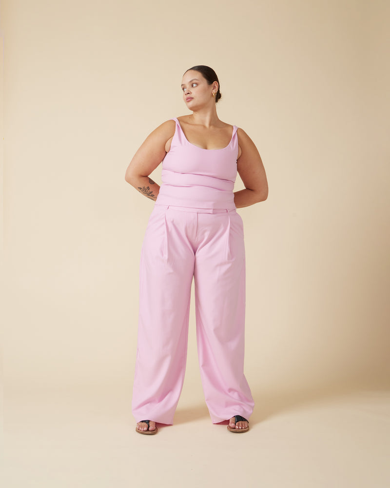 RUE TROUSER MACARON | Straight leg mid-waist suit trouser with a flat waistband and belt loops. These pants are versatile in that they can we be worn casual with a baby tee, or dressed...